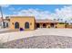 A single-story home with a desert landscape, covered entry, and a warm, inviting facade at 3826 E Equestrian Trl, Phoenix, AZ 85044