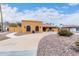 A single-story home featuring a desert landscape, a spacious driveway, and a well-maintained front yard at 3826 E Equestrian Trl, Phoenix, AZ 85044