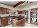 Kitchen featuring granite counters, stainless appliances and an island at 3826 E Equestrian Trl, Phoenix, AZ 85044