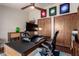 Home office featuring modern furniture, decor, and a nearby closet for storage at 3826 E Equestrian Trl, Phoenix, AZ 85044