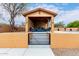 An exterior poolside cabana complete with a lounge area and steps down to the pool at 3826 E Equestrian Trl, Phoenix, AZ 85044