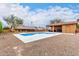 Swimming pool flanked by a poolside cabana and the main house in a desert landscape at 3826 E Equestrian Trl, Phoenix, AZ 85044