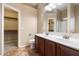 Bathroom features a double sink vanity, tile floors, and a walk-in closet at 383 E Jasper Dr, Chandler, AZ 85225