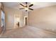 Spacious bedroom with neutral walls and views into bathroom and closet at 383 E Jasper Dr, Chandler, AZ 85225