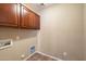 Laundry room has built-in cabinets for storage space at 383 E Jasper Dr, Chandler, AZ 85225