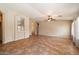 Expansive living room with tile flooring, neutral color scheme, and open layout for versatile furniture arrangement at 383 E Jasper Dr, Chandler, AZ 85225