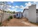 Backyard features desert landscaping and small shed at 4026 E Captain Dreyfus Ave, Phoenix, AZ 85032