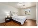 Bright bedroom with wood-look flooring, large window, and designer bedding at 4026 E Captain Dreyfus Ave, Phoenix, AZ 85032