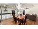 Open-concept dining area with wood floors that flows into the kitchen and living room at 4026 E Captain Dreyfus Ave, Phoenix, AZ 85032