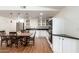 Modern, updated kitchen featuring stainless steel appliances, white cabinets, and dark countertops at 4026 E Captain Dreyfus Ave, Phoenix, AZ 85032