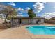 Backyard pool with spacious concrete deck and covered patio is ready for entertaining at 4026 E Captain Dreyfus Ave, Phoenix, AZ 85032