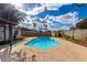 Backyard features a sparkling pool and desert landscaping at 4026 E Captain Dreyfus Ave, Phoenix, AZ 85032