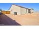 Back of house shows a covered patio and desert landscaping at 4130 N Del Monte Dr, Eloy, AZ 85131