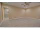 A roomy carpeted bedroom with recessed lighting and a view into the en suite bathroom at 4130 N Del Monte Dr, Eloy, AZ 85131