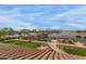 Elevated view of a pool, lake, and common area in the community with well manicured landscaping at 42368 W North Star Dr, Maricopa, AZ 85138