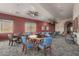 Inviting community room with tables, chairs, and lots of natural light for activities and gatherings at 42368 W North Star Dr, Maricopa, AZ 85138