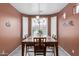 Bright dining room with chandelier and large window providing natural light at 42368 W North Star Dr, Maricopa, AZ 85138