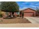 Inviting single-story home with a two-car garage, xeriscaped yard and mature desert landscaping at 42368 W North Star Dr, Maricopa, AZ 85138