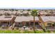 Aerial view of the home's backyard and patio with desert landscaping and seating area at 42368 W North Star Dr, Maricopa, AZ 85138