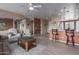 Open-concept living room flowing into the kitchen, featuring laminate flooring and neutral tones at 42368 W North Star Dr, Maricopa, AZ 85138