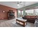 Comfortable living room with laminate floors, a ceiling fan and sliding doors to the backyard at 42368 W North Star Dr, Maricopa, AZ 85138