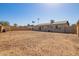 Large, mulch-covered backyard with a block fence, perfect for creating your outdoor oasis at 4366 E Burgess Ln, Phoenix, AZ 85042