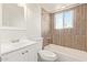 Bathroom featuring updated flooring, sink and a shower and tub at 4366 E Burgess Ln, Phoenix, AZ 85042