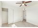 Bedroom featuring wood-look floors, closet, and access to the other parts of the house at 4366 E Burgess Ln, Phoenix, AZ 85042