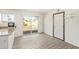 Dining area with light walls, new flooring, and sliding glass doors to the backyard at 4366 E Burgess Ln, Phoenix, AZ 85042