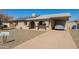 Inviting single-story home featuring a covered carport, stone landscaping, and a well-maintained driveway at 4366 E Burgess Ln, Phoenix, AZ 85042