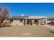 Charming single-story home featuring a covered carport, modern solar panels, and neutral exterior paint at 4366 E Burgess Ln, Phoenix, AZ 85042