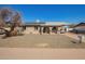 Single-story home with neutral colors, complemented by drought-resistant landscaping at 4366 E Burgess Ln, Phoenix, AZ 85042