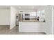 Modern kitchen featuring stainless steel appliances, granite countertops, and crisp white cabinets at 4366 E Burgess Ln, Phoenix, AZ 85042