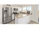 Modern kitchen with stainless steel appliances, granite countertops, and white cabinetry at 4366 E Burgess Ln, Phoenix, AZ 85042