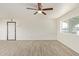 Inviting living room featuring neutral paint, new flooring, and a bright window overlooking the front yard at 4366 E Burgess Ln, Phoenix, AZ 85042