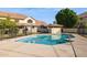 Community pool surrounded by fencing, concrete, landscaping and views of the property at 455 S Mesa Dr # 126, Mesa, AZ 85210