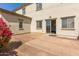 Backyard with patio, bougainvillea, and windows at 4675 E Olney Ave, Gilbert, AZ 85234