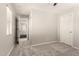 Bedroom with gray carpet and connecting door at 4675 E Olney Ave, Gilbert, AZ 85234