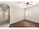 Bedroom featuring wood floors, a ceiling fan, neutral walls, and a window with blinds for natural light at 4675 E Olney Ave, Gilbert, AZ 85234