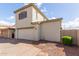 Two-story home with a two-car garage, neutral stucco, brick driveway and landscaped yard at 4675 E Olney Ave, Gilbert, AZ 85234