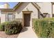 Charming home featuring a covered entry, a stone facade, and trimmed bushes along the walkway at 4675 E Olney Ave, Gilbert, AZ 85234