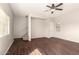 Bright and airy living room with modern fan and staircase leading to the second floor at 4675 E Olney Ave, Gilbert, AZ 85234