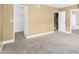 Bedroom with neutral carpet, and access to the closet and bathroom at 6159 E Indian School Rd # 110, Scottsdale, AZ 85251