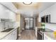 Bright kitchen featuring granite counters, stainless steel appliances and white subway tile backsplash at 6159 E Indian School Rd # 110, Scottsdale, AZ 85251