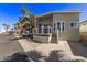 Inviting home with a lovely porch, neutral siding, decorative windows, and mature landscaping at 632 Aero Rd, Mesa, AZ 85205