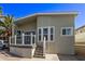 Beautiful home with a welcoming porch, neutral siding, decorative windows and mature landscaping at 632 Aero Rd, Mesa, AZ 85205