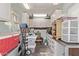 Organized garage space with ample storage cabinets and overhead lighting at 632 Aero Rd, Mesa, AZ 85205