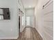 Hallway with modern doors and fixtures, enhanced by neutral paint and attractive wood-look flooring at 632 Aero Rd, Mesa, AZ 85205