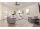 Bright and airy living room featuring wood floors, lots of natural light, and comfortable seating at 632 Aero Rd, Mesa, AZ 85205