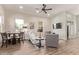 Bright living room with a ceiling fan, wooden floors, and a view of the outdoor scenery at 632 Aero Rd, Mesa, AZ 85205